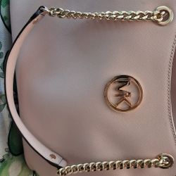 Michael Kors Jet Set Travel Large Chain Shoulder Tote Bag in a light pink 