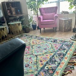 Rose red velvet Chesterfield chair,  wool area rug, Antique secretary desk