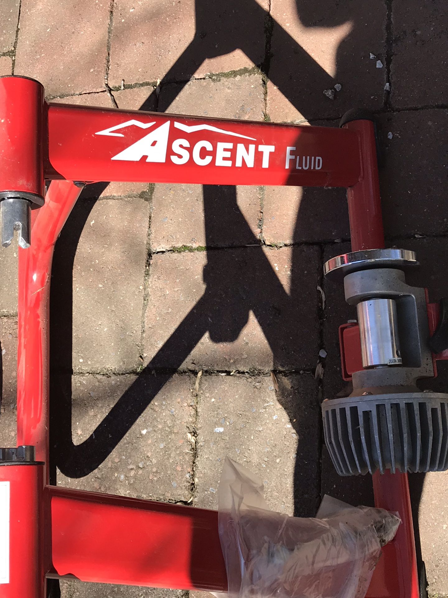 Red metal ASCENT bike trainer & front chock