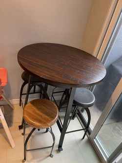 The Ashley Furniture D(contact info removed)44 Challiman Round Dining Room Counter Table