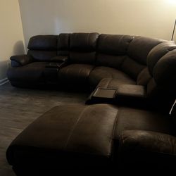 Brown Four piece Sectional With Massager, Recliner, Lights, Cupholders And Compartments 