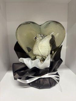 Preserved rose in glass casing