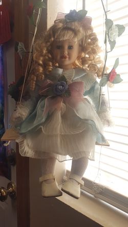 Doll on swing