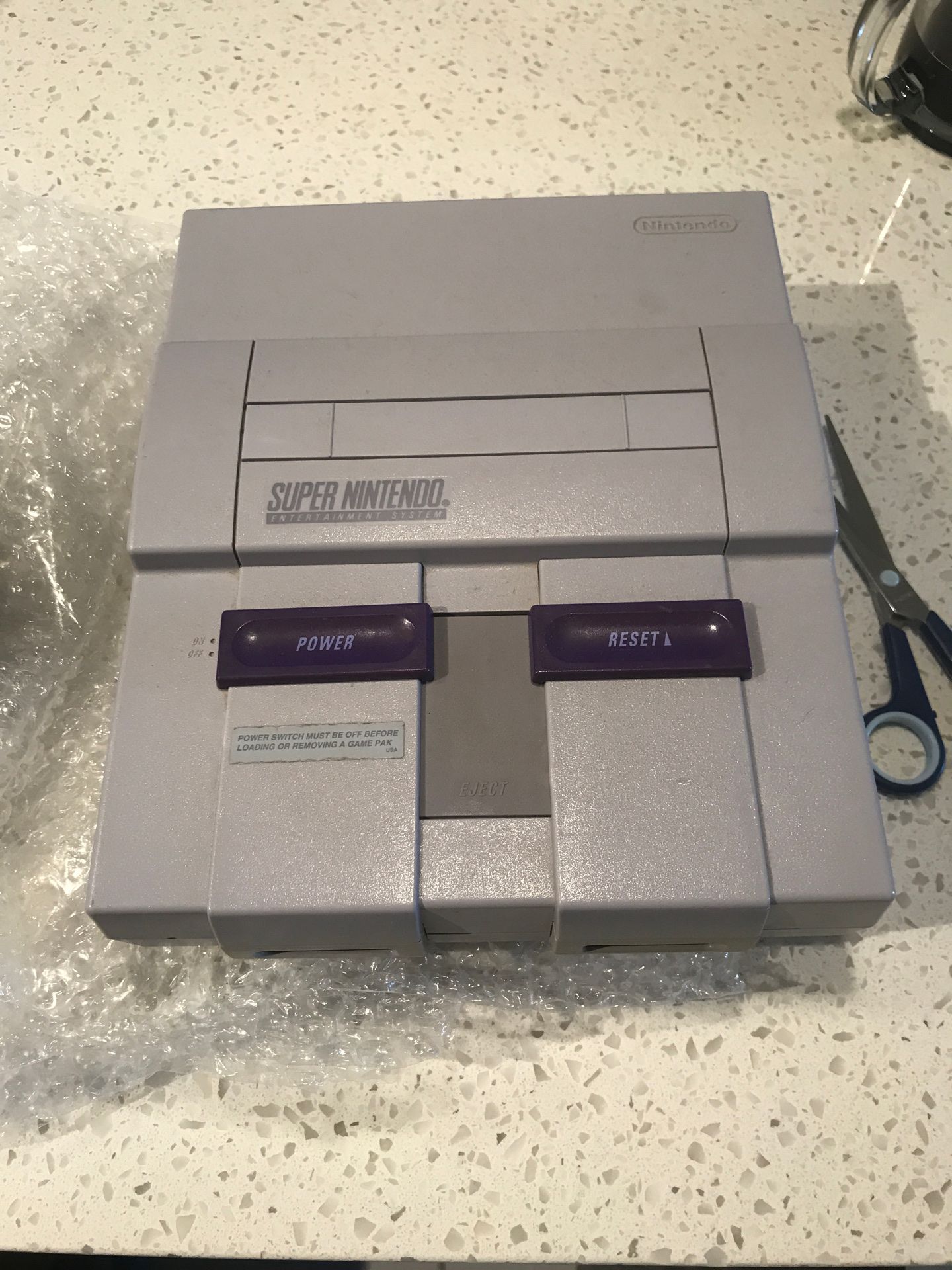 Super Nintendo with 2 control and 6 games including Super Mario World.