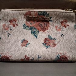 Juicy Couture Wristlet White Rose Zippered Up Bag. Used, but In Good Condition!....asking $20.00