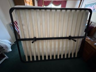 Queen bed support slats. Great condition! Very sturdy foldable metal frame.. like new!