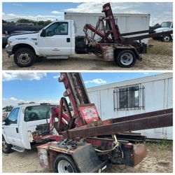 Small bins and dumpster truck