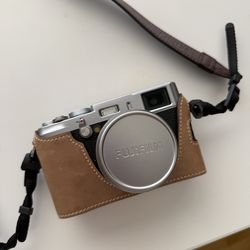 Fujifilm X100S digital camera with cases and batteries