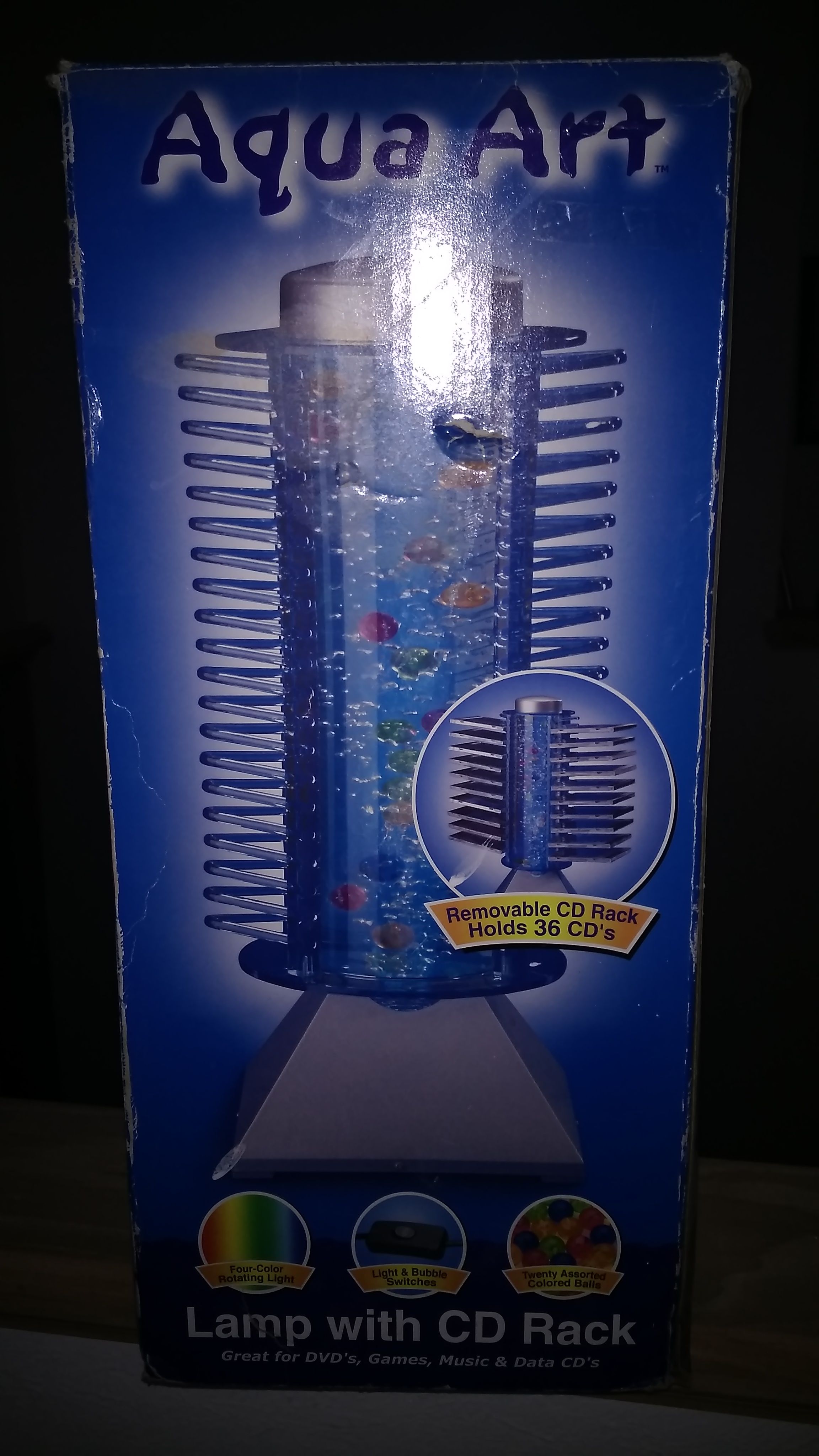 Cool Aqua art lamp with CD rack. Never used still in box.