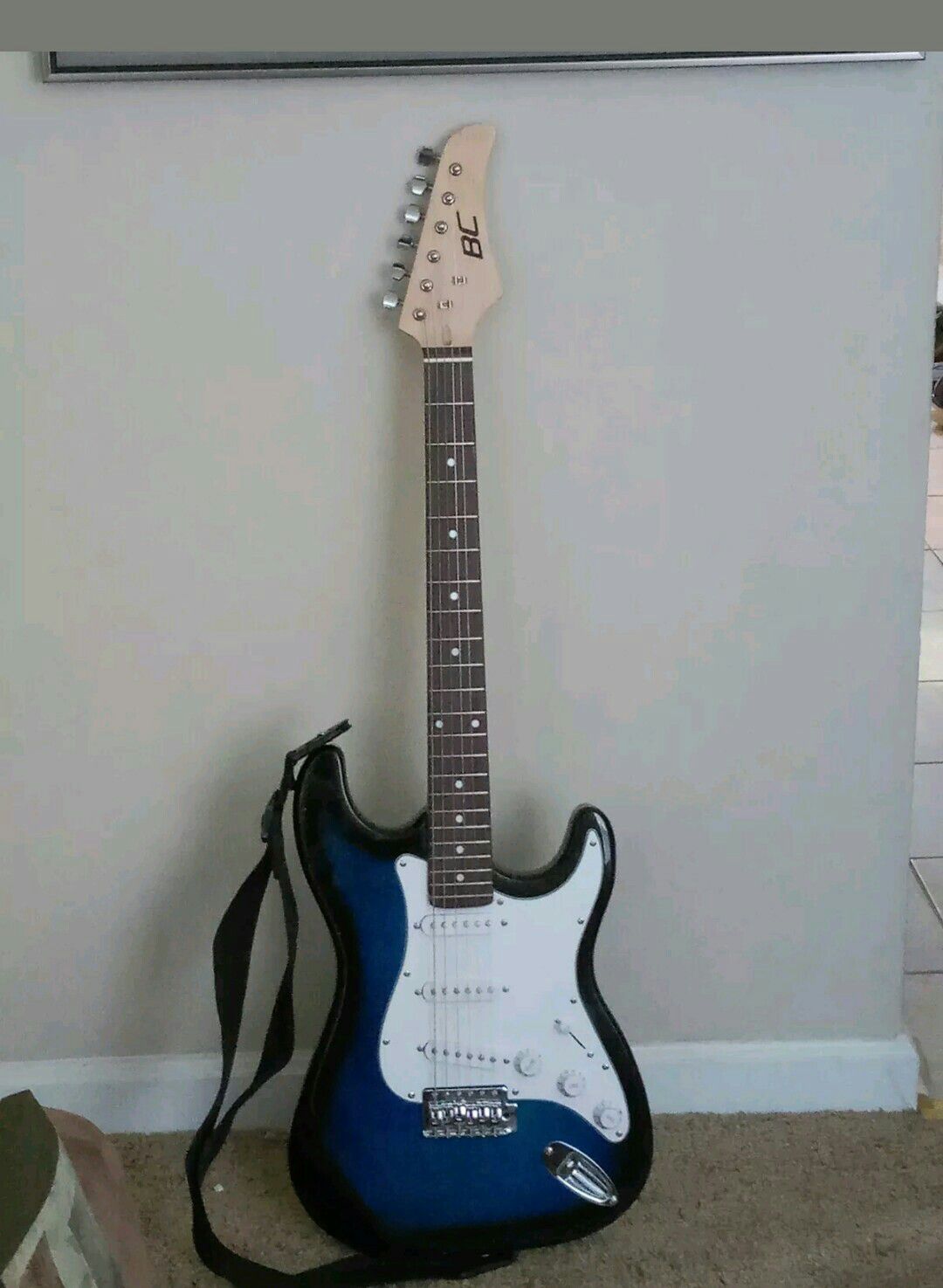 B C ELECTRIC GUITAR with Shoulder Strap.  Medium Size. Comes with shoulder strap.