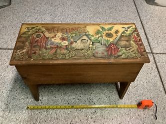 Wooden bench vintage with storage top has a country scene with birds and birdhouses very sturdy and clean  stands about 19” tall Width is 25” depth is