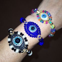 EYE CRYSTAL AND BEADED BRACELETS