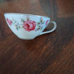 Vintage teacup featuring a pink rose floral pattern