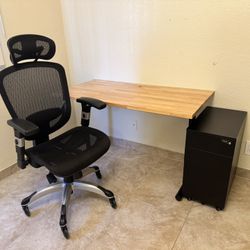 Desk, office chair and filing cabinet