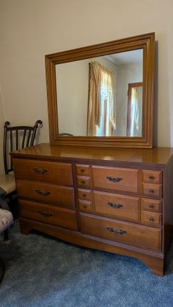 Wooden dresser with mirror attached