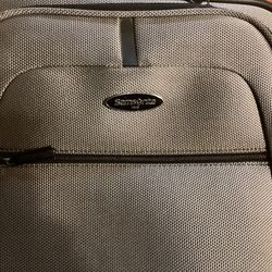 Samsonite Carry On Luggage.( Grey) Dimensions are: 14”W —10”D — 20”H
