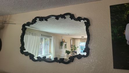 Large black ornate mirror