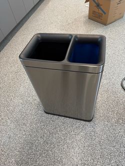 Modern dual-compartment stainless steel trash and recycling bin. Great for an office, kitchen, break room or garage.