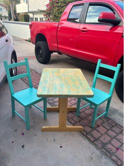 Bistro size wooden heavy dining table with 2 wooden ladder back chairs
