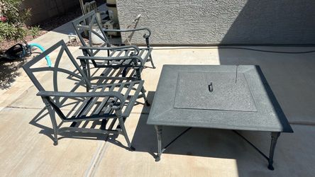 Metal outdoor furniture and fireplace