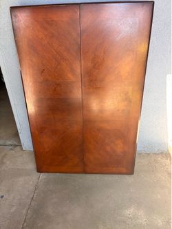 Wooden dining room table with chairs