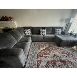    3 - Piece Sectional With Chase Grey Fabric 139”   With Right Arm 91” Facing Chase. 