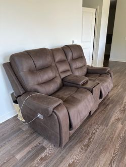 Reclining leather couch built in charging stations