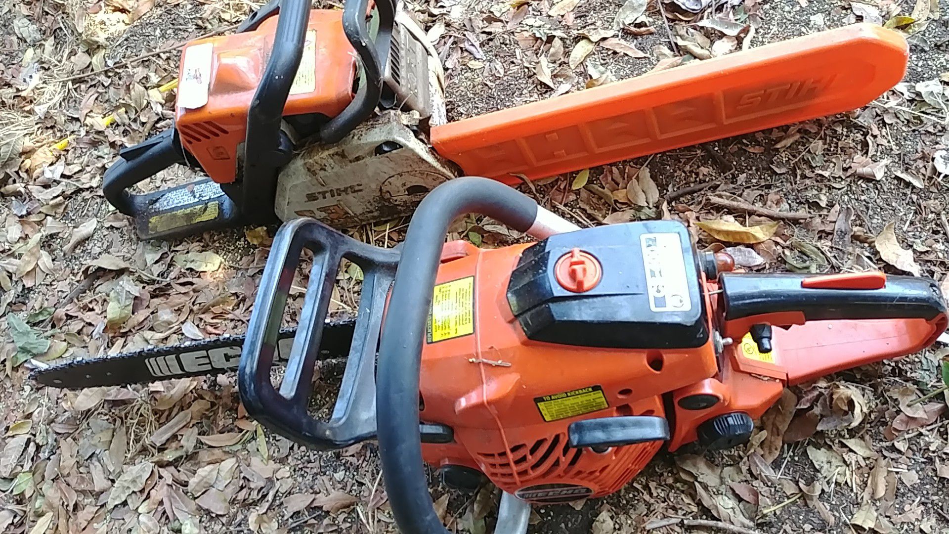 Two small arborist chainsaw Stihl and Echo