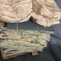 10 Huggies Diapers & 10 Swaddles 