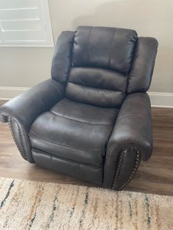 Dark brown rocker/recliner