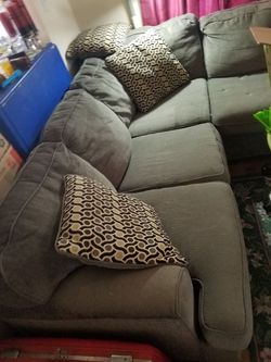 Gray couch with pillows