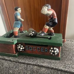 Vintage, cast-iron, mechanical soccer coin bank