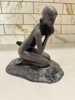 Signed M. Stelzer for Franklin Mint statue dated 1980, "Kneeling Nude (Girl) with Flowers"
