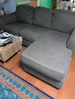 L-shape gray sofa and matching chair