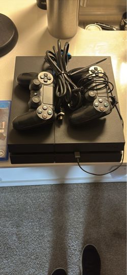 Sony PlayStation 4 Console with Two Controllers