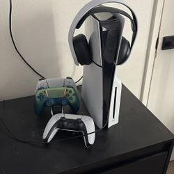 PS5 headset and 3 controllers