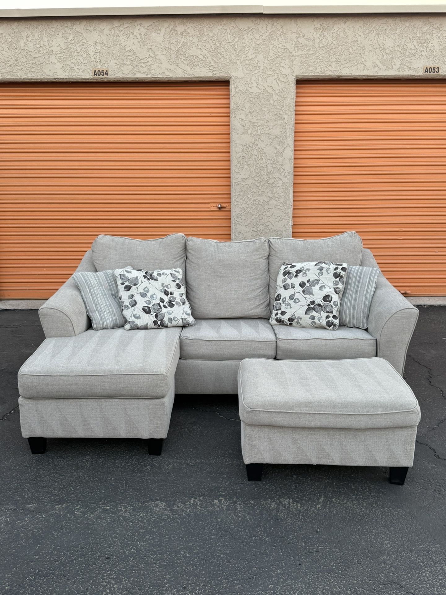 FREE DELIVERY - Ashley Furniture Beige Sectional Couch W/ Reversible Chaise + Ottoman + Pullout Bed