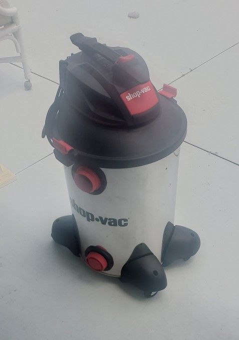 Stainless steel Shop-Vac with red accents.