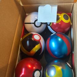 Case of empty Pokémon Poké ball tins