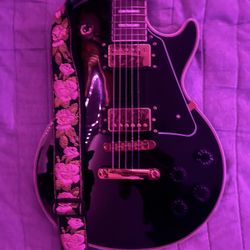 Black 6 String Les Paul Guitar