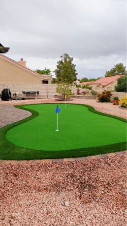 Back yard turf pavers and pergolas