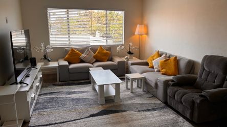 2 sofa and easily seats 6 adults with 2 tea tables. TV stand