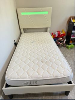 Twin bed with built-in light. . Mattress not included