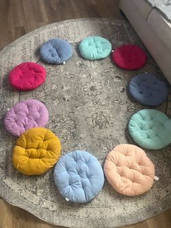 Twelve 16” round student classroom cushions