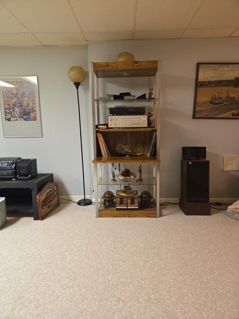 Entertainment stand with four shelves and a record compartment