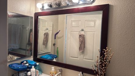 large mirror with wood frame