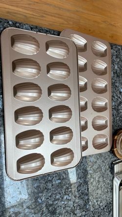 : Madeleine baking pans / cookie trays featuring classic scalloped shell molds.