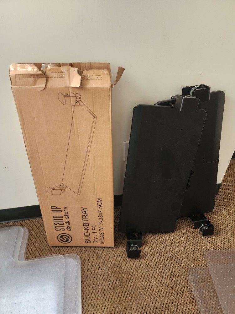 Store under-desk keyboard tray.