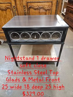 Nightstand Metal & Glass Stainless Steel TopWe are located at 2811 East Bell road. Another Time Around Furniture.