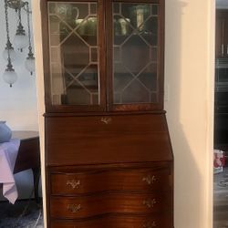 Antique mahogany secretary desk.  In great condition for its age.  Comes with key. 